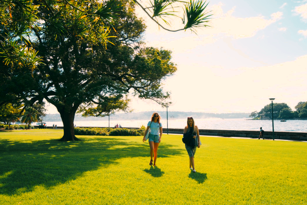 A photo of two women walking in the Botanic Gardens in Sydney