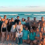 Tour group enjoying Bondi Beach at sunset