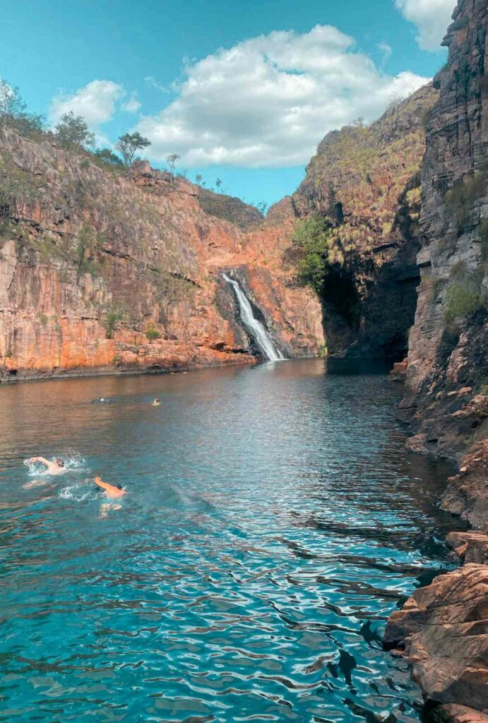 Twin falls, 2 young guy travellers swimming, Community tour, Northern Territory, Welcome to Travel