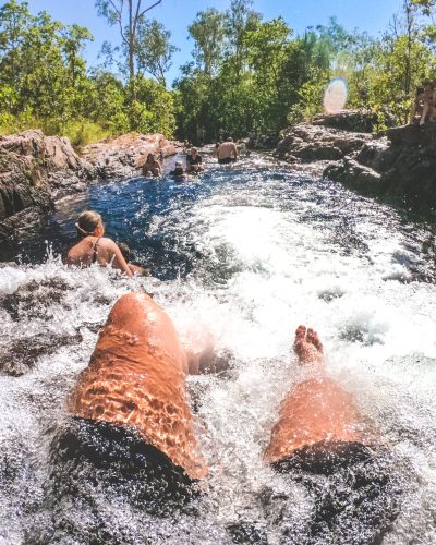Visitors sitting in the rock pool at Buley Rockhole.Get set for real adventure and to connect with nature at Litchfield National Park. At just over an hour from Darwin, it's every local's favourite day trip with its waterfalls and water holes, bush walks, four-wheel drive tracks, birds and wildlife.